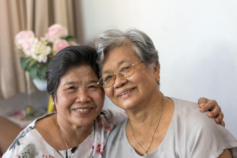 Two women with warm smiles 